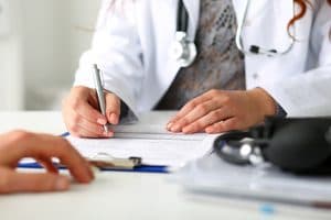 doctor verifying Medicaid coverage for addiction treatment