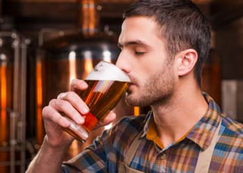 man drinking alcohol