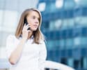 woman talks on the phone in the city